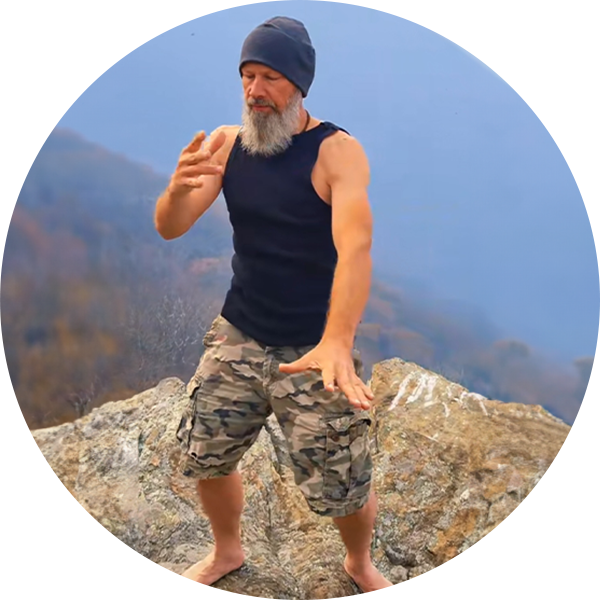 Steve doing functional movement while standing on rocks